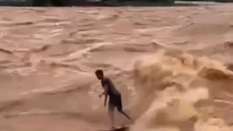Daredevil Surfer Embraces Nature’s Fury: Paulo Guido Coelho Rides the Swollen Doce River